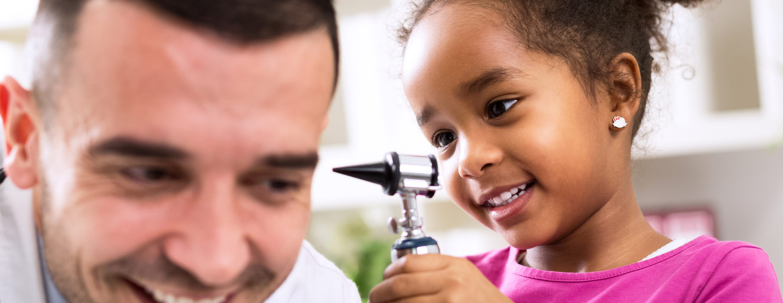 Male Physician with young girl